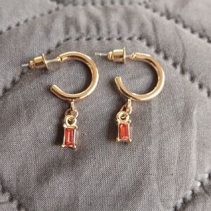 Elegant Gold Hoop Earrings with Red Gemstone Charm